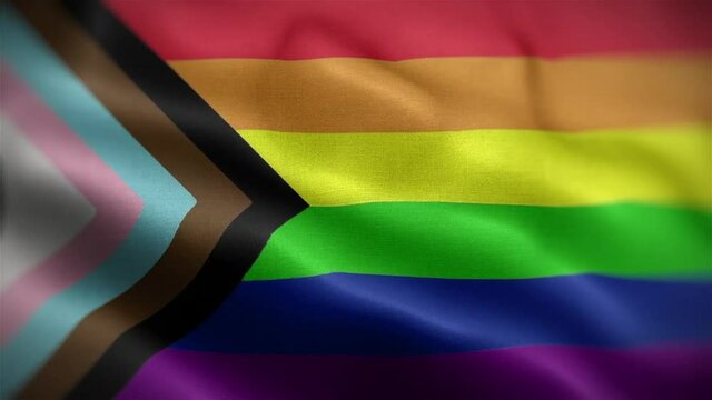 Angled view of the Newly designed Gay Pride Rainbow Flag flapping in HD.