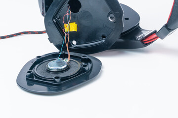 Broken headphones with a microphone. Repair concept. Close-up.