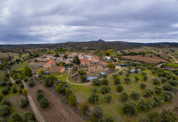Drone aerial view of Idanha a velha historic village and landscape with Monsanto on the background, in Portugal