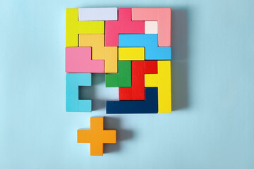 Multicolored puzzle, cubes on a blue background