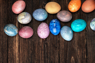 Different easter eggs on wooden  table