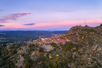 Drone aerial panorama view of Monsanto historic village at sunset, in Portugal © Luis