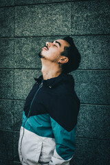 Boy with blue jacket posing