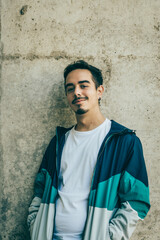 Boy with blue jacket posing