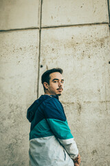 Boy with blue jacket posing