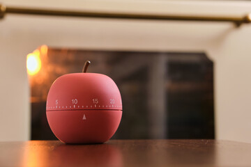 modern kitchen timer apple shaped on the background of the kitchen