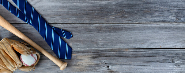 Blue striped tie with baseball stuff on aged wooden planks for Happy Fathers Day