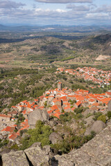 Obraz premium Monsanto historic village with stone boulder buildings and rooftops seen from the castle, in Portugal