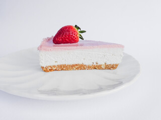 Homemade cheesecake with fresh strawberries for dessert - healthy organic summer pie .Cheesecake   isolated on white background