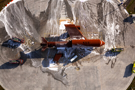 Aerial View Of Fire Fighters Undertaking Fire Training At Melbourne Airport, Australia.