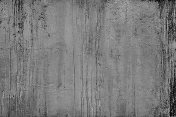 Old broken sanded aged painted facade of rusty smudged dark daub. Rough wrinkled edge plaster from uneven wall. Cracked chipped messy falling stucco. Dirty vintage flaking textured layer for 3D design