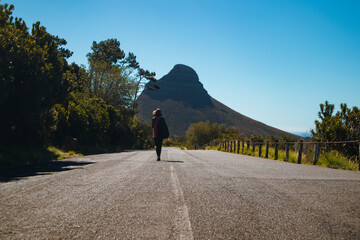 person walking on the road