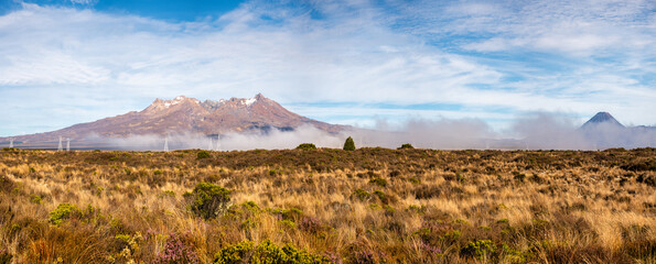 Low cloud partially covering the volcanic Mountain Peaks in the tundra and tussock covered desert...