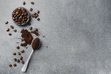 Coffee beans in bowl on grey background - 416639023