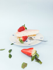 Creamy mascarpone cheese cake with strawberry . Piece of New York Cheesecake. Close up. Christmas dessert. Healthy food. Flat lay creative food concept.