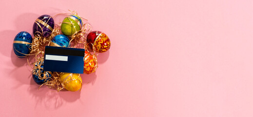 Top view of easter eggs and credit card.