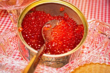 Red salmon caviar in iron jar