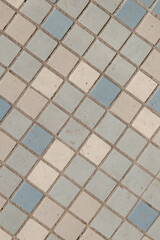 small square tiles in bathroom. Blue and pink tiles. Old tiles 