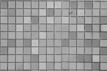 small square tiles in bathroom. black and white tiles. Old tiles 