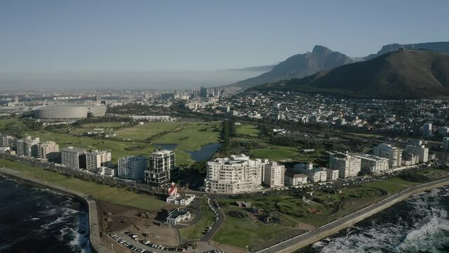 Aerial view of Cape Town, Western Cape, South Africa, with Cape peninsula, Green Point, V and A waterfront, Cape Town Stadium, De Waterkant, on a bright and sunny day filmed in 4k with a drone