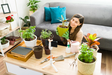 Happy female gardener talking about gardening online