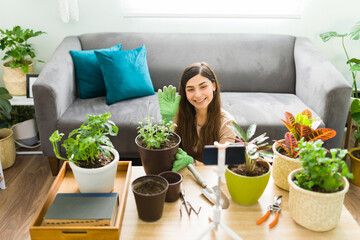 Young woman feeling happy while doing her gardening hobby