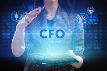 Business, Technology, Internet and network concept. Young businessman working on a virtual screen of the future and sees the inscription: CFO
