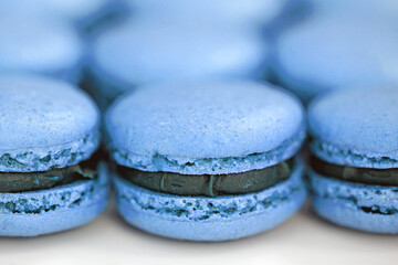 Colorful homemade macaron cookies filled with ganache cream