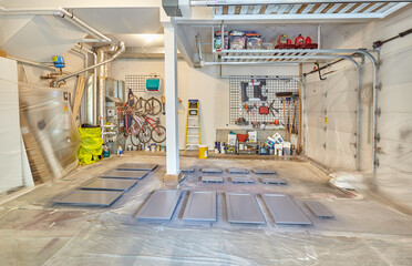 Garage as spray painting station. Cabinet doors and drawer fronts drying after being spray painted...