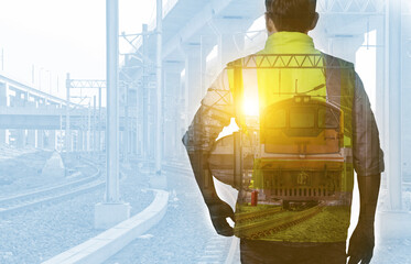 Double exposure back view engineer railway with helmet under inspection and checking construction...