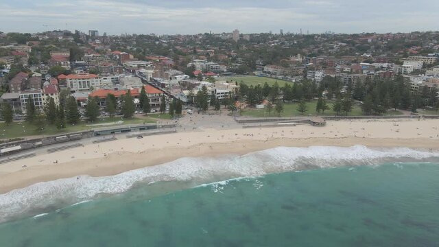 Tourists Relaxing At Sandy Shore Of Coogee Beach With Goldstein Reserve Park - Coastal Suburb Of Coogee, Sydney, NSW, Australia. - aerial