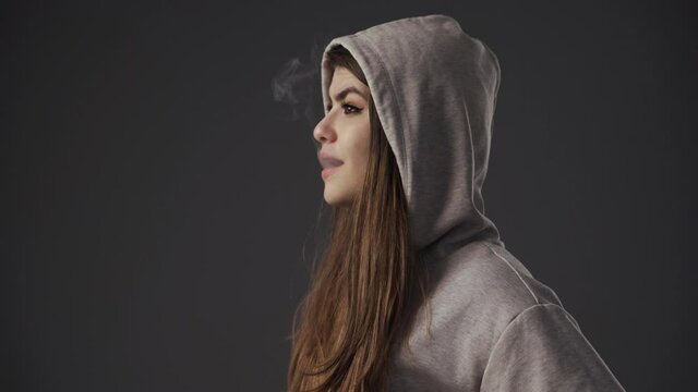 Young woman smoking electronic cig