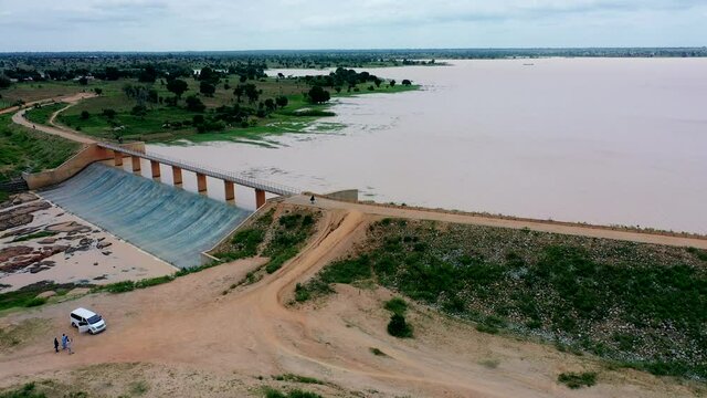 Overflow water runs off the Ajiwa dam in Nigeria's Katsina State - sliding aerial view
