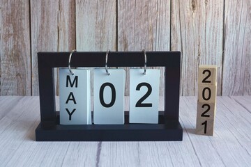 Text on wooden block cube and paper stand frame. Labor day concept