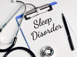 Medical and health concept. Phrase SLEEP DISORDER written on paper clipboard with stethoscope and a pen. 