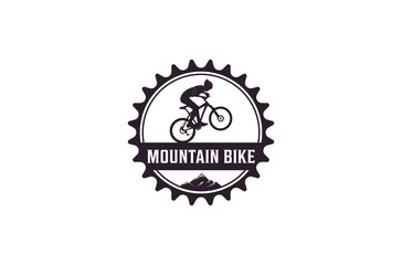 Mountain bike logo complete with illustration of a cyclist riding a bicycle with gusto