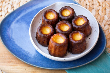 A plate of french pastries, Canelés de Bordeaux