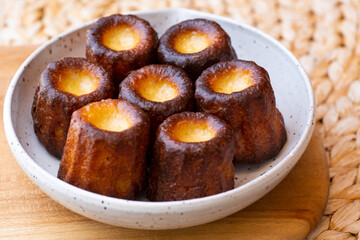A plate of french pastries, Canelés de BordeauxA plate of french pastries, Canelés de Bordeaux
