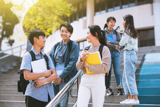 Happy Teenager Students talking and Walking On Stairs