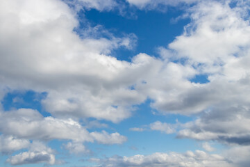 Naklejka na ściany i meble white clouds and blues sky background