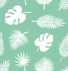 Vector seamless pattern of white hand drawn palm leaves silhouette isolated on mint background
