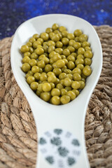 White ceramic bowl full with marinated olive
