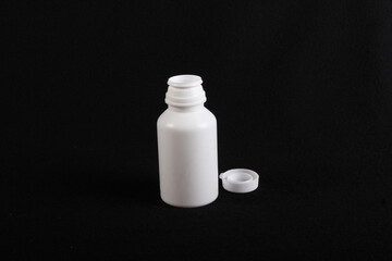 Pills Platic bottle, black background