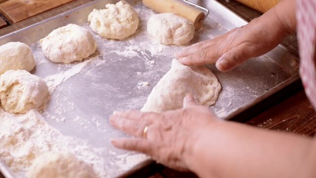 Panzerotti and calzone folding process homemade by senior chef