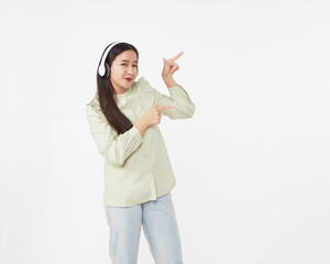 Joyful beautiful young Asian girl in headphones
