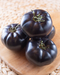 Obraz na płótnie Canvas Black or dark purple heirloom tomatoes