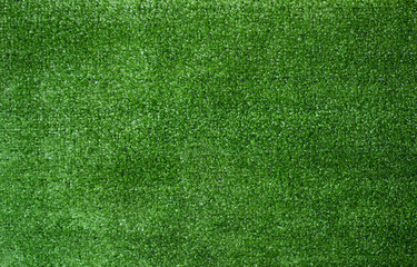 Artificial green grass texture background top view.