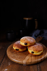 Donat bomboloni labu. Pumpkin bomboloni doughnuts with chocolate filling.