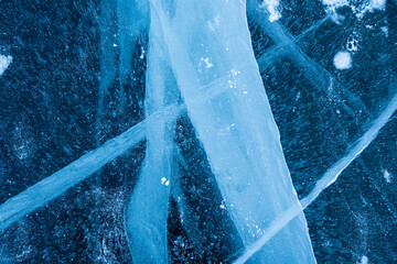 Shot of frozen waters full of cracks of baikal lake ice.
