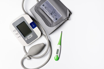 tonometer and thermometer on a white background